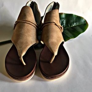 Tan colored sandals with threading detail